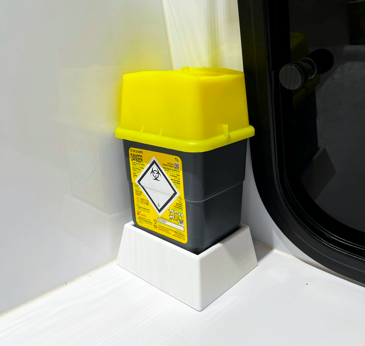 Base de maintien pour boites à aiguille Sharpsafe